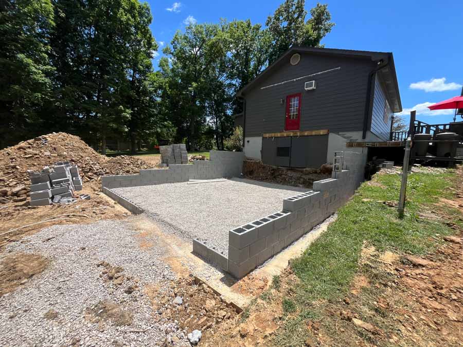 Concrete block foundation walls on a gravel base, built beside an existing house: residential excavation by Rooney Excavating of Seymour, TN